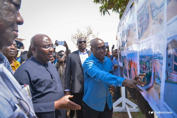 Vice-President Mahamudu Bawumia (3rd right) being briefed on the project designs by officials of the Department of Urban Roads. With them are the Minister of Roads and Transport, Mr Kwasi Amoako-Atta (4thright) and Mr Titus-Glover (2nd right), the MP for Tema East.