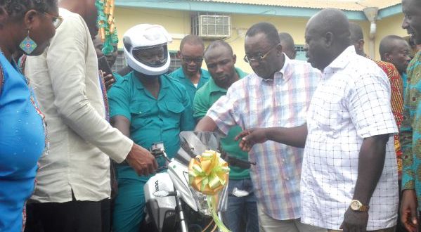 Dr Owusu Afriyie Akoto (second right) symbolically starting the engine of one of the motorbikes