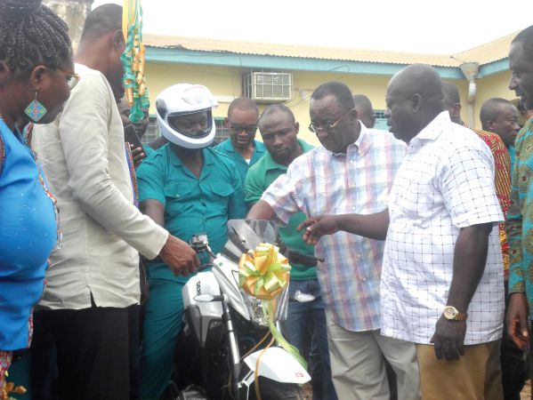Dr Owusu Afriyie Akoto (second right) symbolically starting the engine of one of the motorbikes
